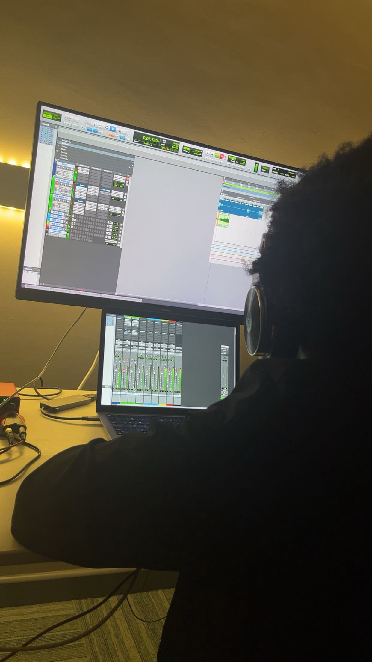 Mixing session with the arrangement on the monitor and laptop